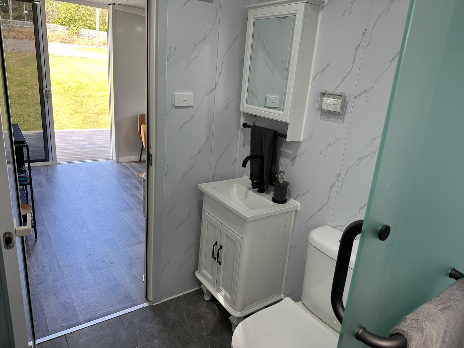 Ensuite bathroom with glass shower screen